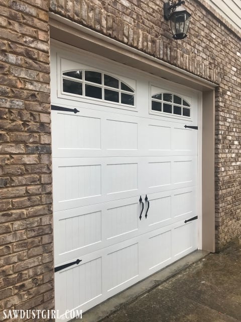 Clean a garage door with household cleaners