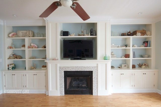 Built-in bookshelves and fireplace surround. https://sawdustgirl.com